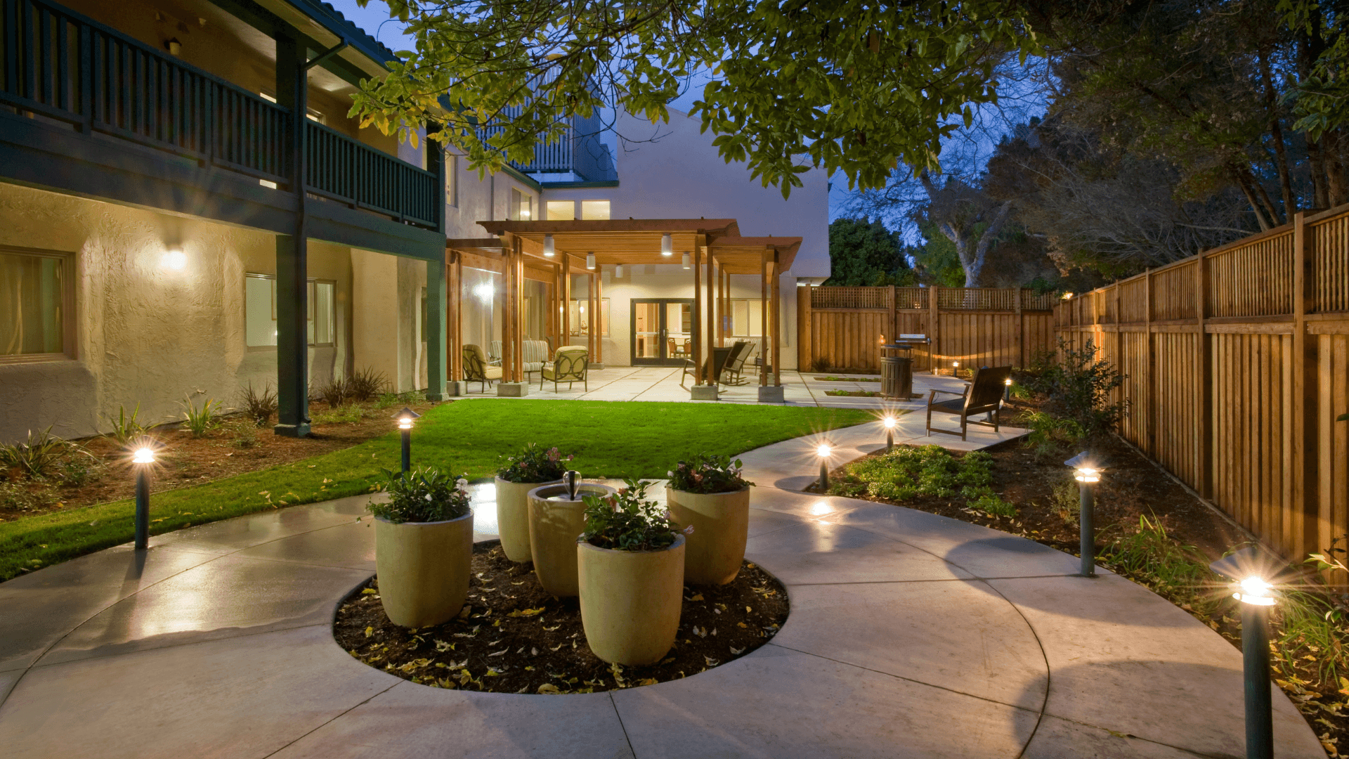 Home exterior with wood deck wall-wash lighting, outdoor lighting installed by Blue Bolt Electric near Cincinnati, OH